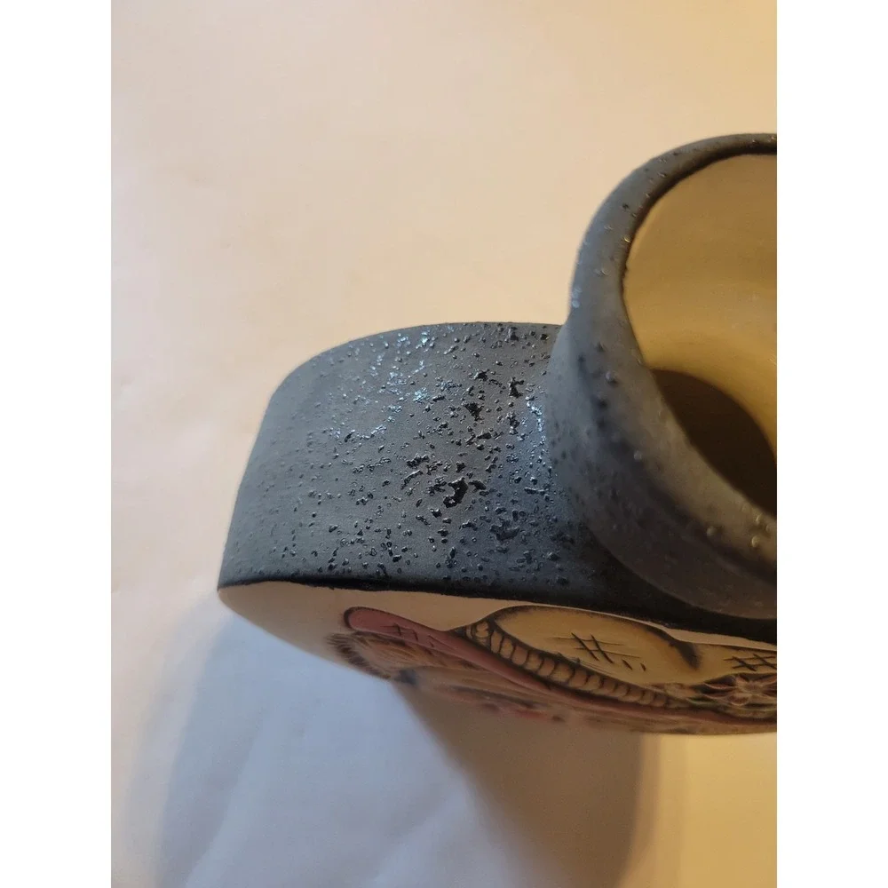 Handmade ceramic sad